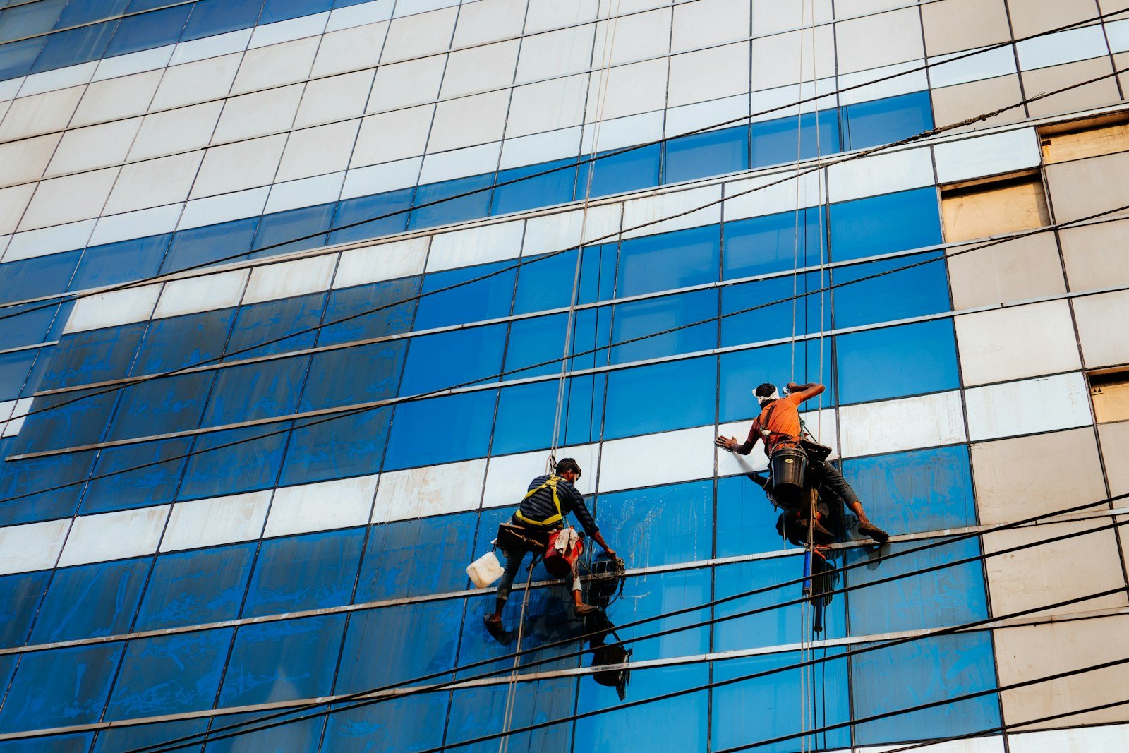 Window cleaning crew on building facade